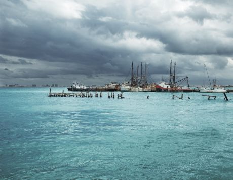 Rusty fishing boats in Cancun harbor