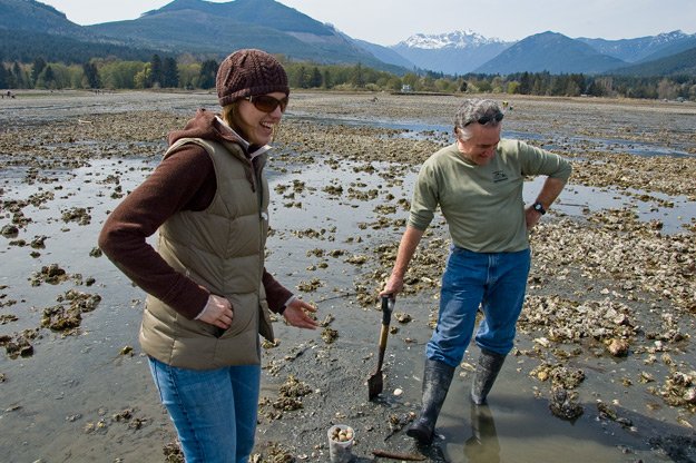 Willo chats with a guy we found digging clams. Olympic mountains in the background.