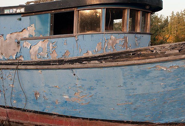 Decaying boat at the roadside