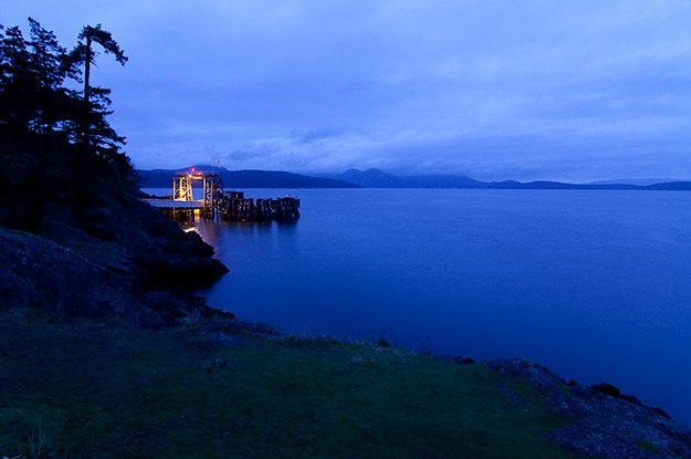 Our cabin was right next to the ferry landing. If you cut through the woods next to the landing you come upon a grassy point that's a perfect vantage point for the ferry dock and the sunrise. Not much of a sunrise this day, but the blue quality of the light was amazing.