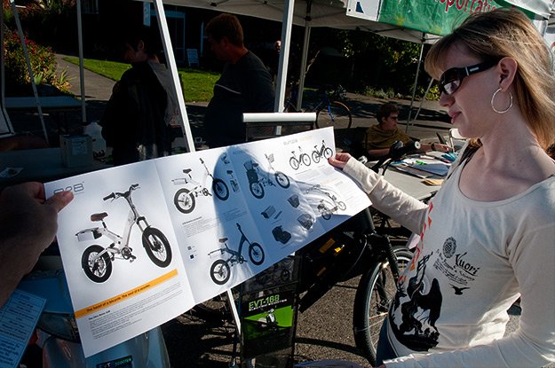 Seattle's Ballard neighborhood held a sustainability festival in September. Here Willo peruses a brochure for the electric bike she subsequently purchased.